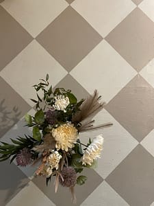 Cream and warm brown coloured flooring painted in a tile pattern