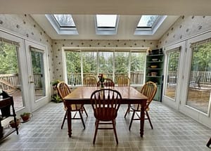 Dated dining Room with tons of natural light