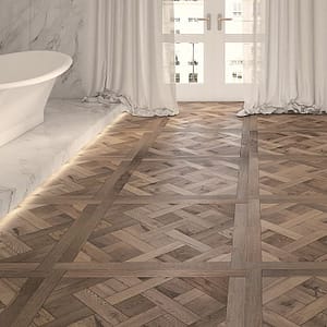 Real wood parquet floor made up of wood pieces glues into a rich pattern